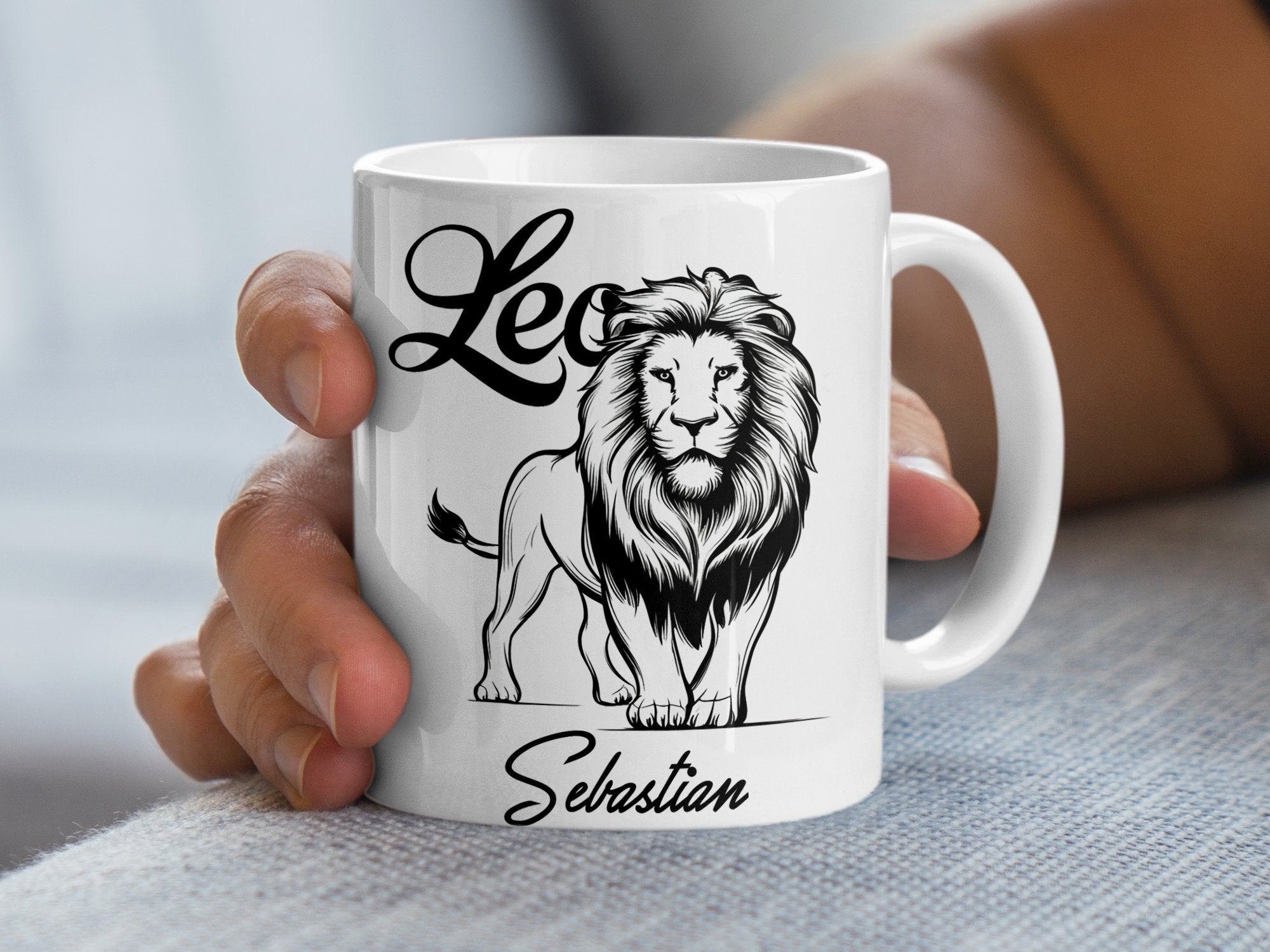 White mug with a lion graphic and "Leo Sebastian" text.