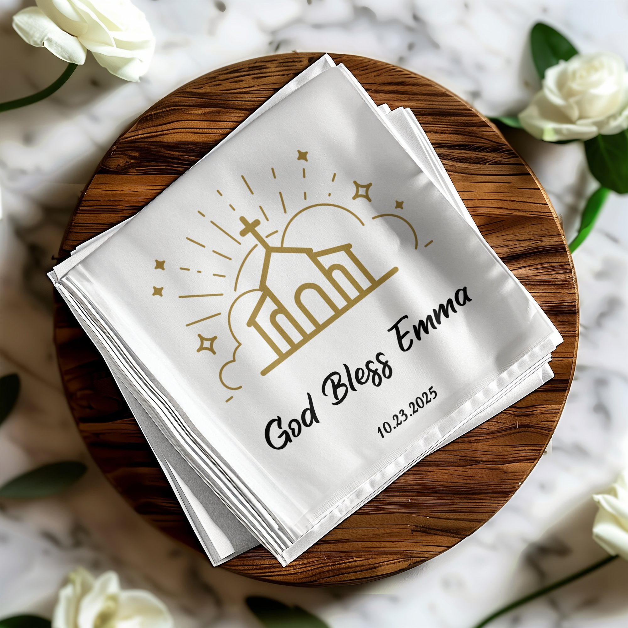 White cloth napkins with "God Bless Emma" and a church graphic.