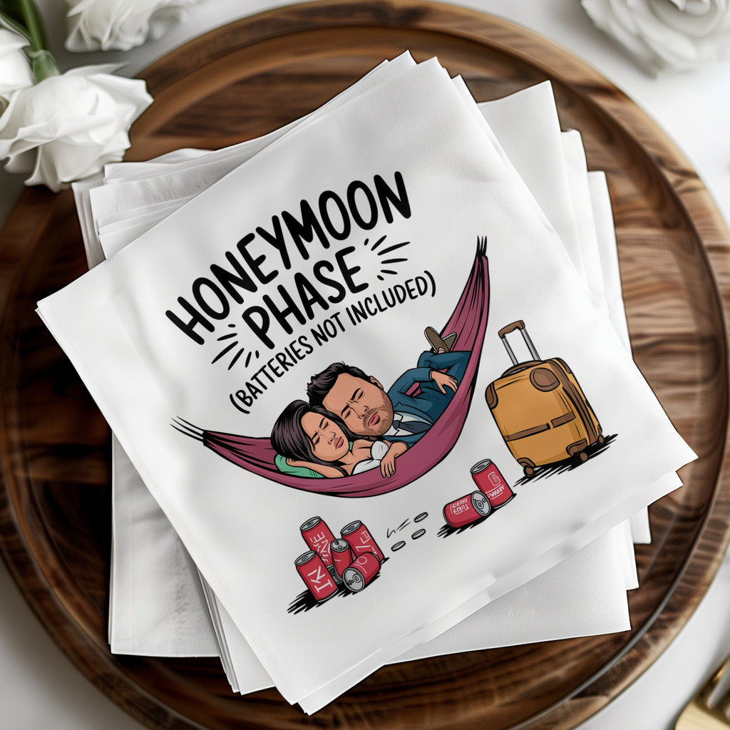Honeymoon Phase napkins with couple in hammock and suitcase.