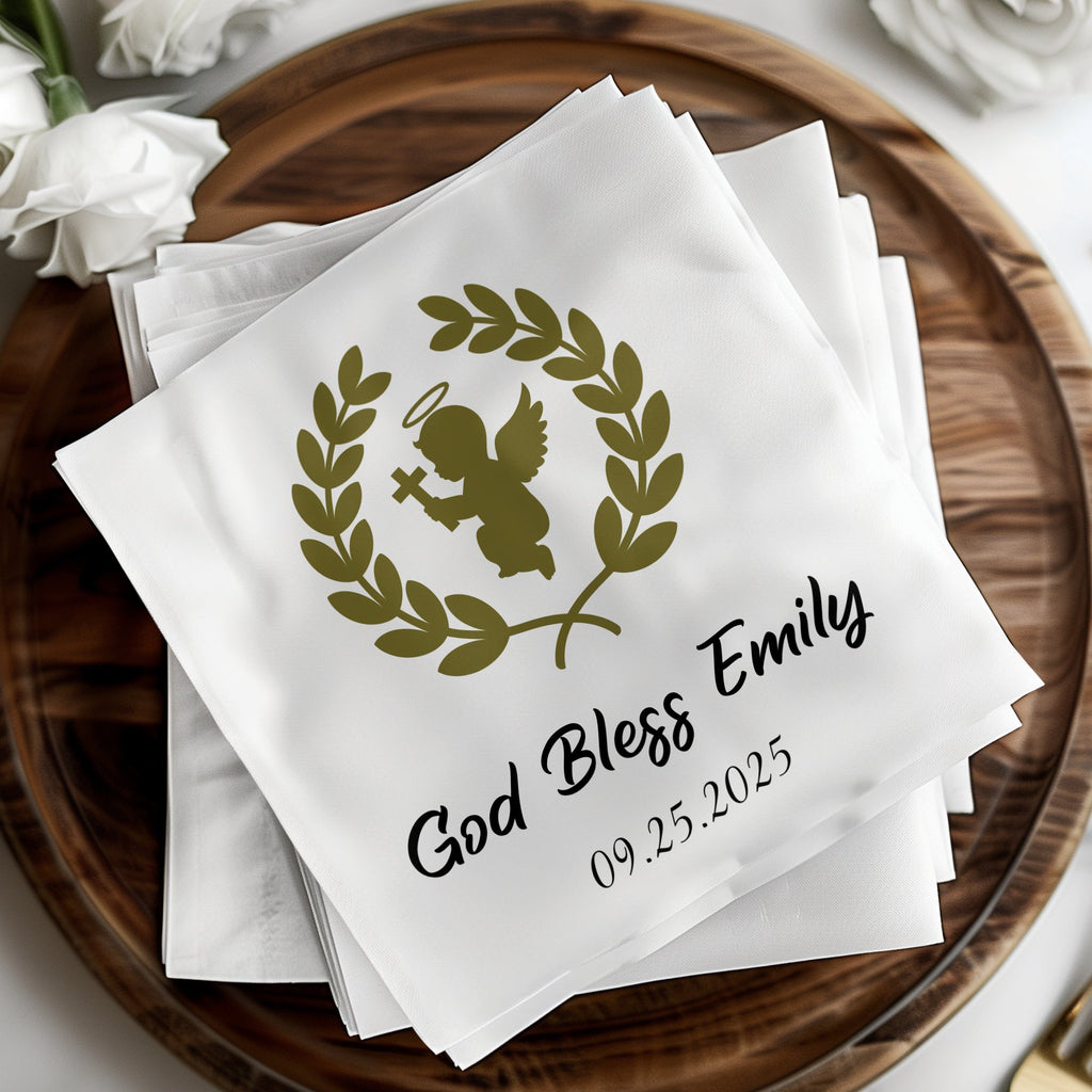 White napkin with olive branch, angel, "God Bless Emily," and date.