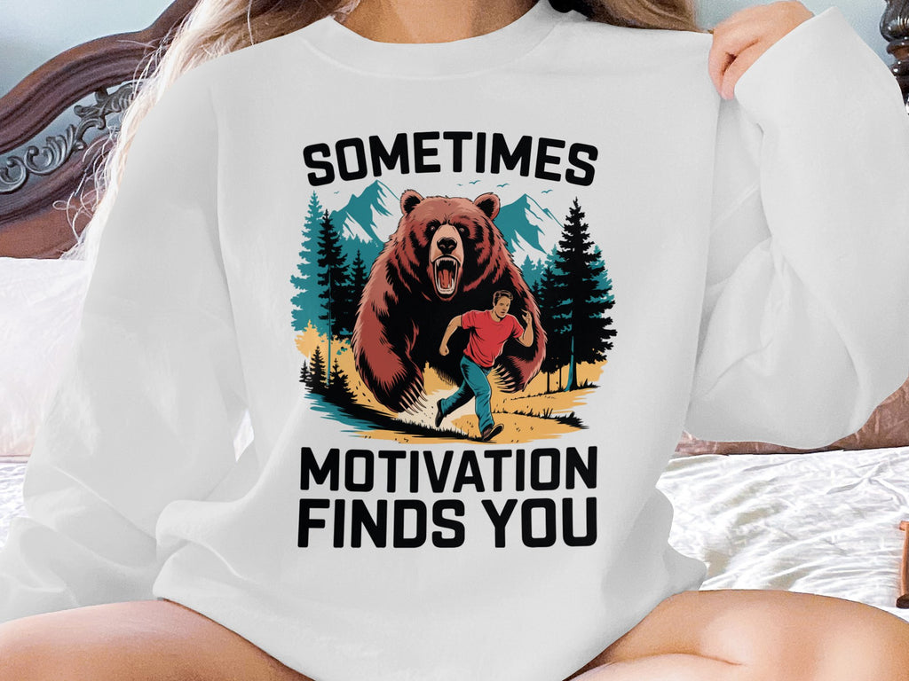Bear chasing man in woods with text "Sometimes Motivation Finds You".