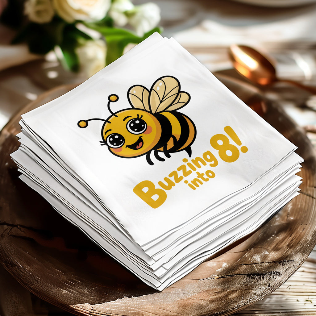 Stack of white napkins with a cartoon bee saying "Buzzing 8 into".