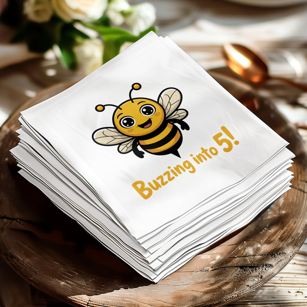 White napkin with cartoon bee and "Buzzing into 5!" text.