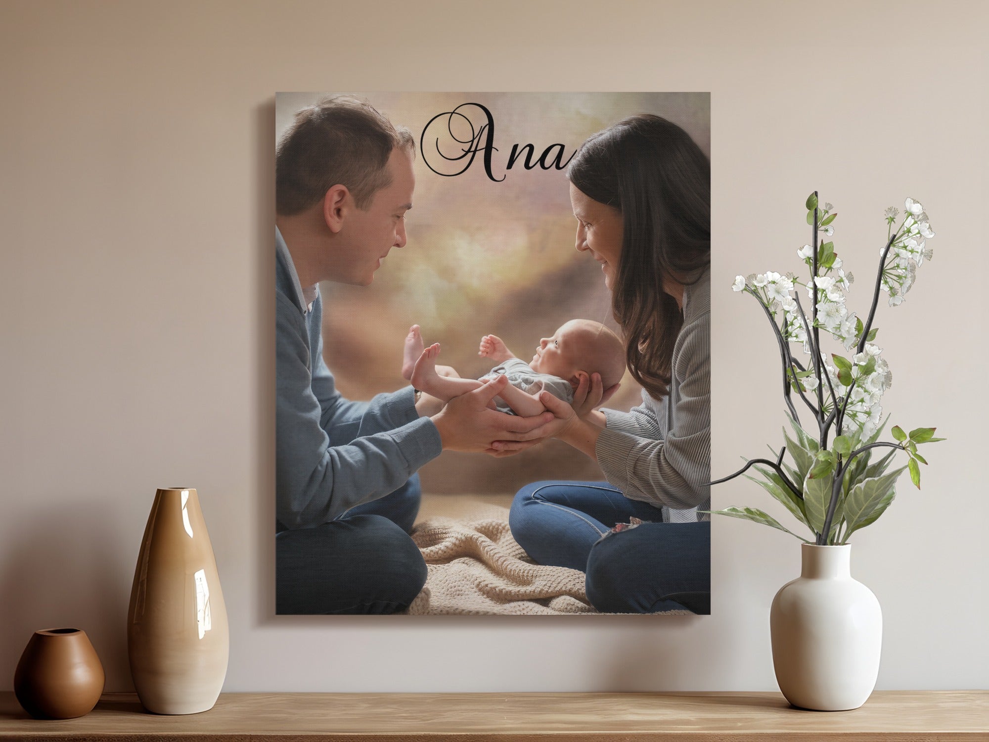 Parents hold newborn baby, name "Ana" printed above.
