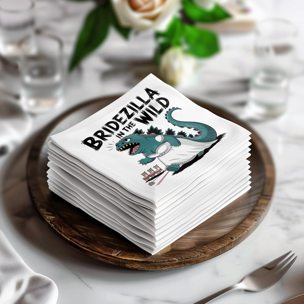 Stack of napkins with "Bridezilla in the Wild" text and cartoon dinosaur graphic.
