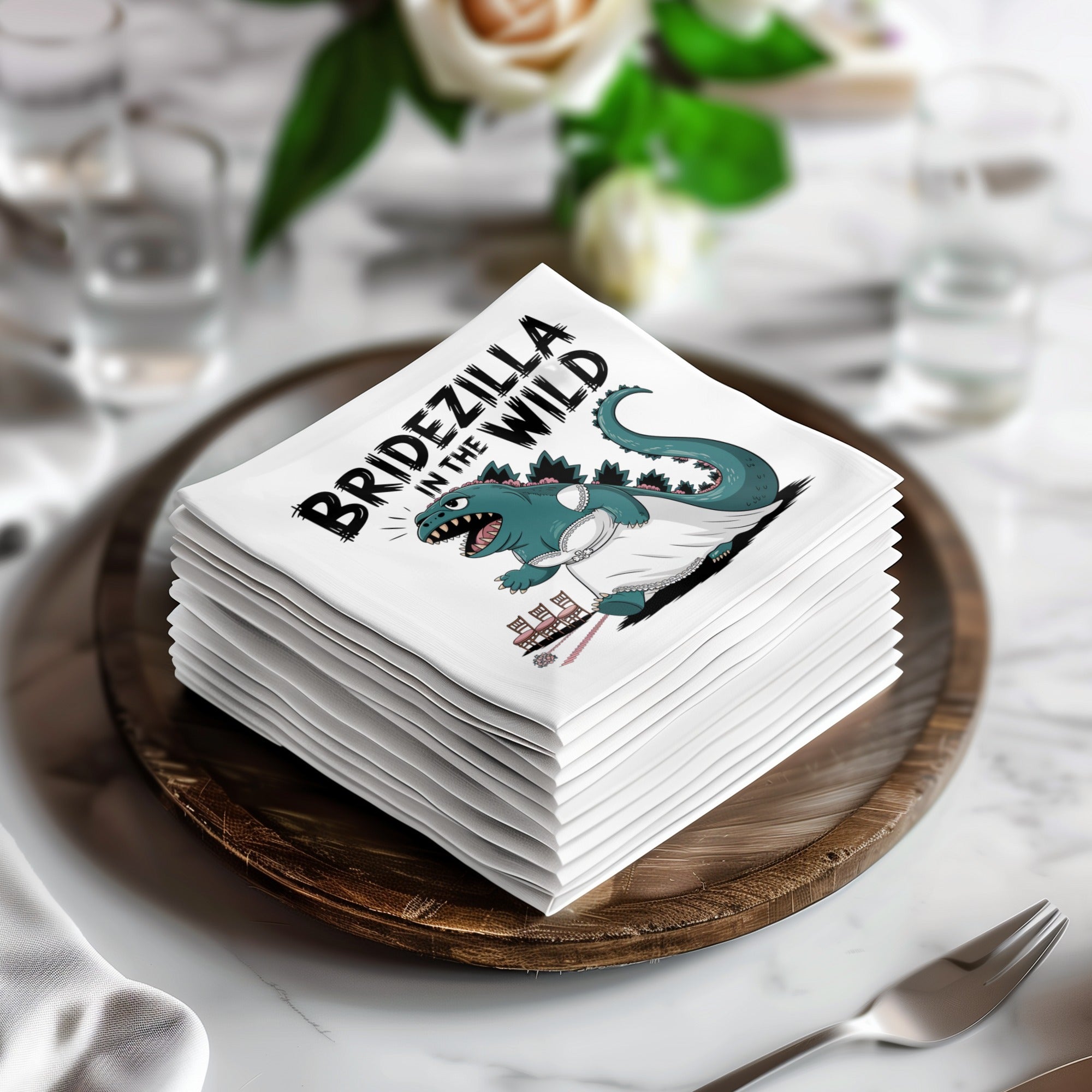Stack of napkins with "Bridezilla in the Wild" text and cartoon dinosaur graphic.