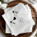 White napkins with black crowns, 'N' monogram, and November 24, 2025.