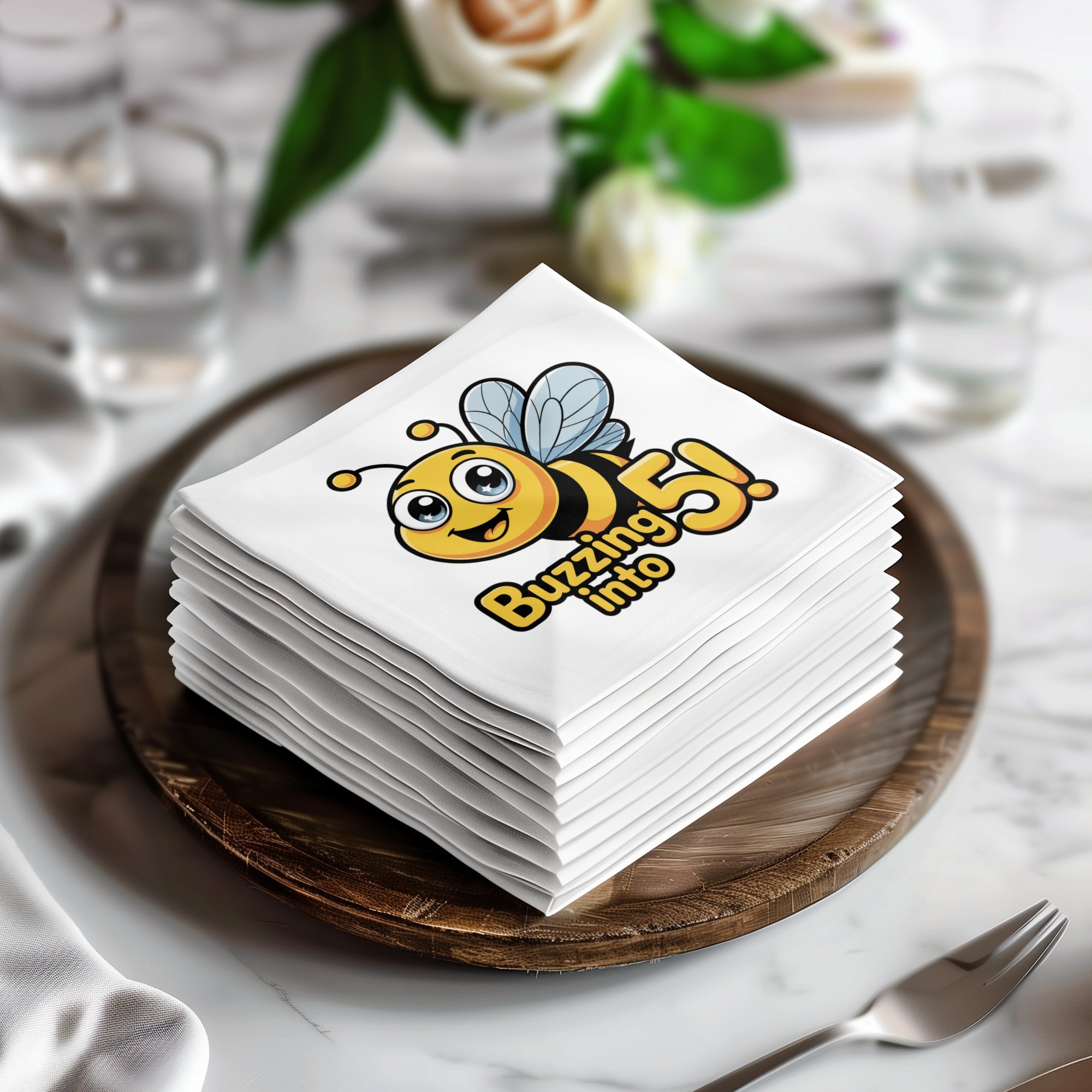 Stack of napkins with a bee saying "Buzzing into 5!".