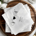 White cocktail napkins with black monogram "N" and "V" and "November 24, 2025".