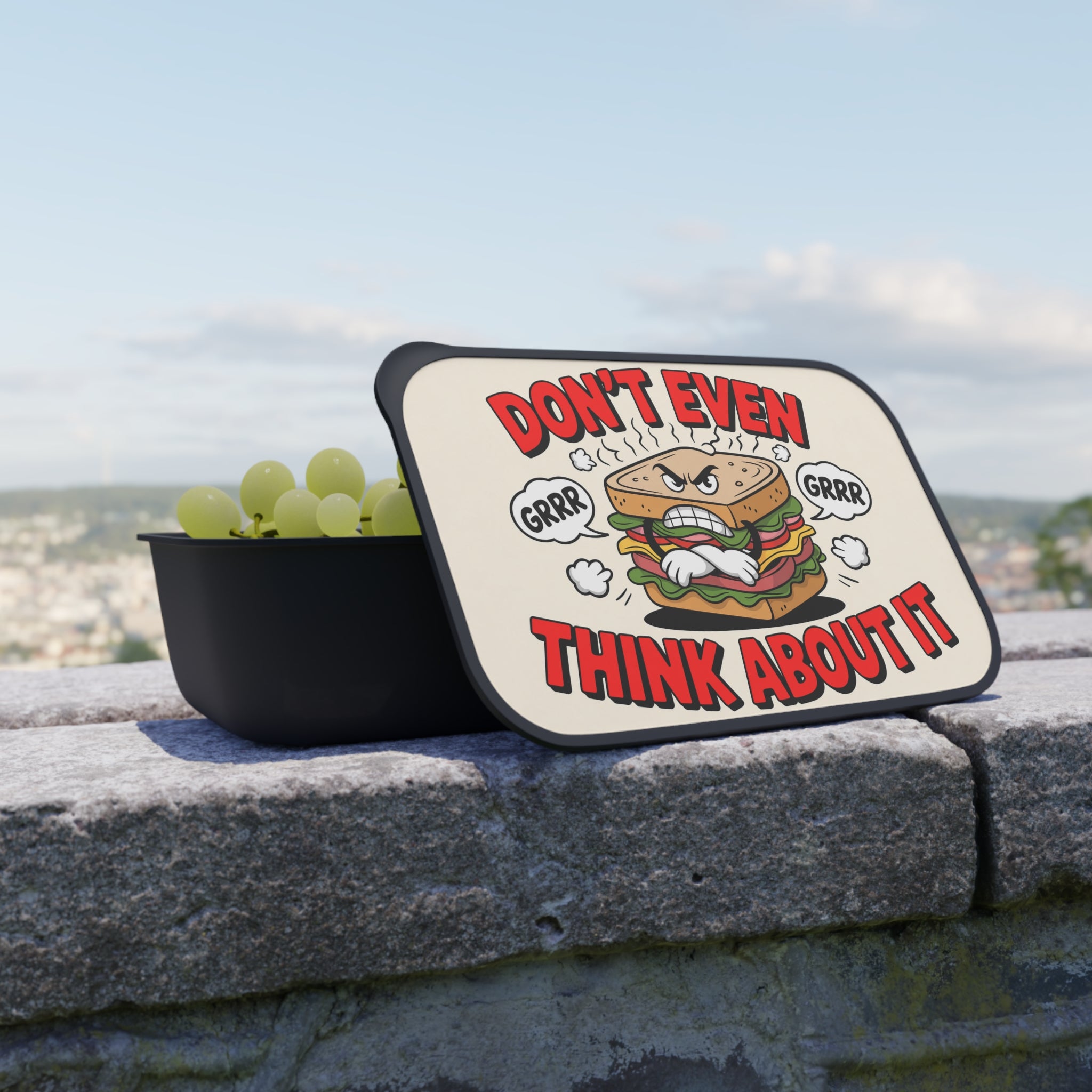 Lunchbox with cartoon sandwich and text "DON'T EVEN THINK ABOUT IT".