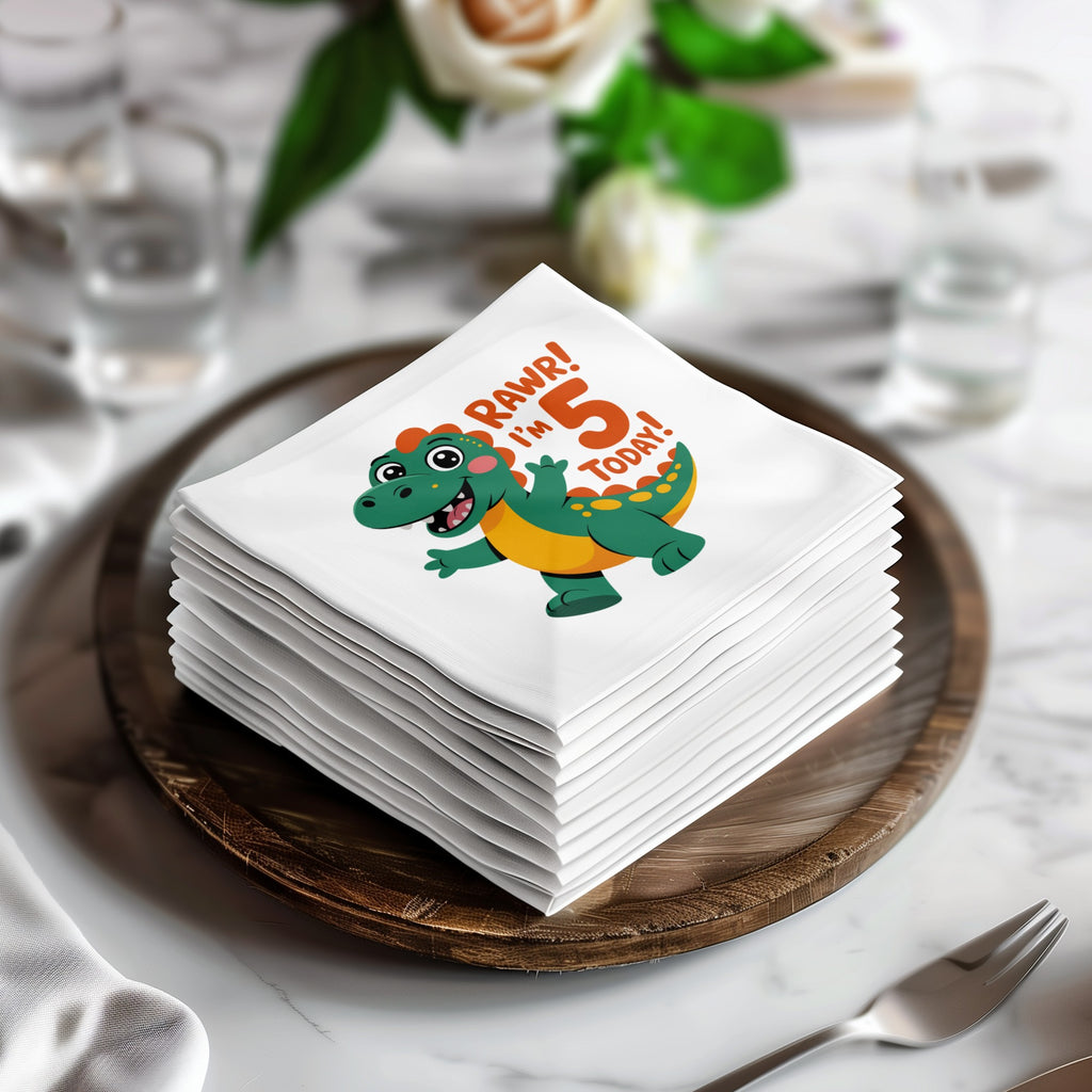 Stack of white napkins with a cartoon dinosaur saying "Rawr! I'm 5 Today!".