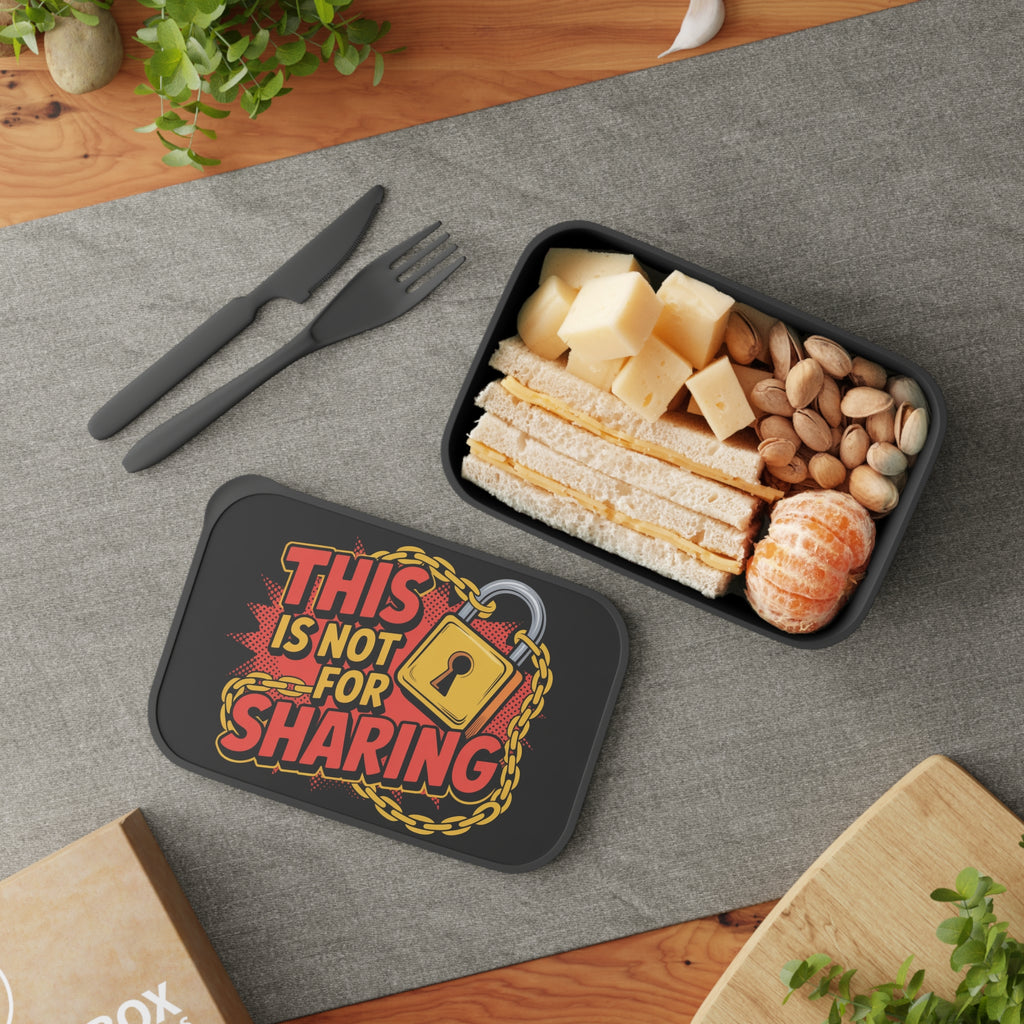 Lunchbox with "This is not for sharing" text and padlock graphic, contains food.