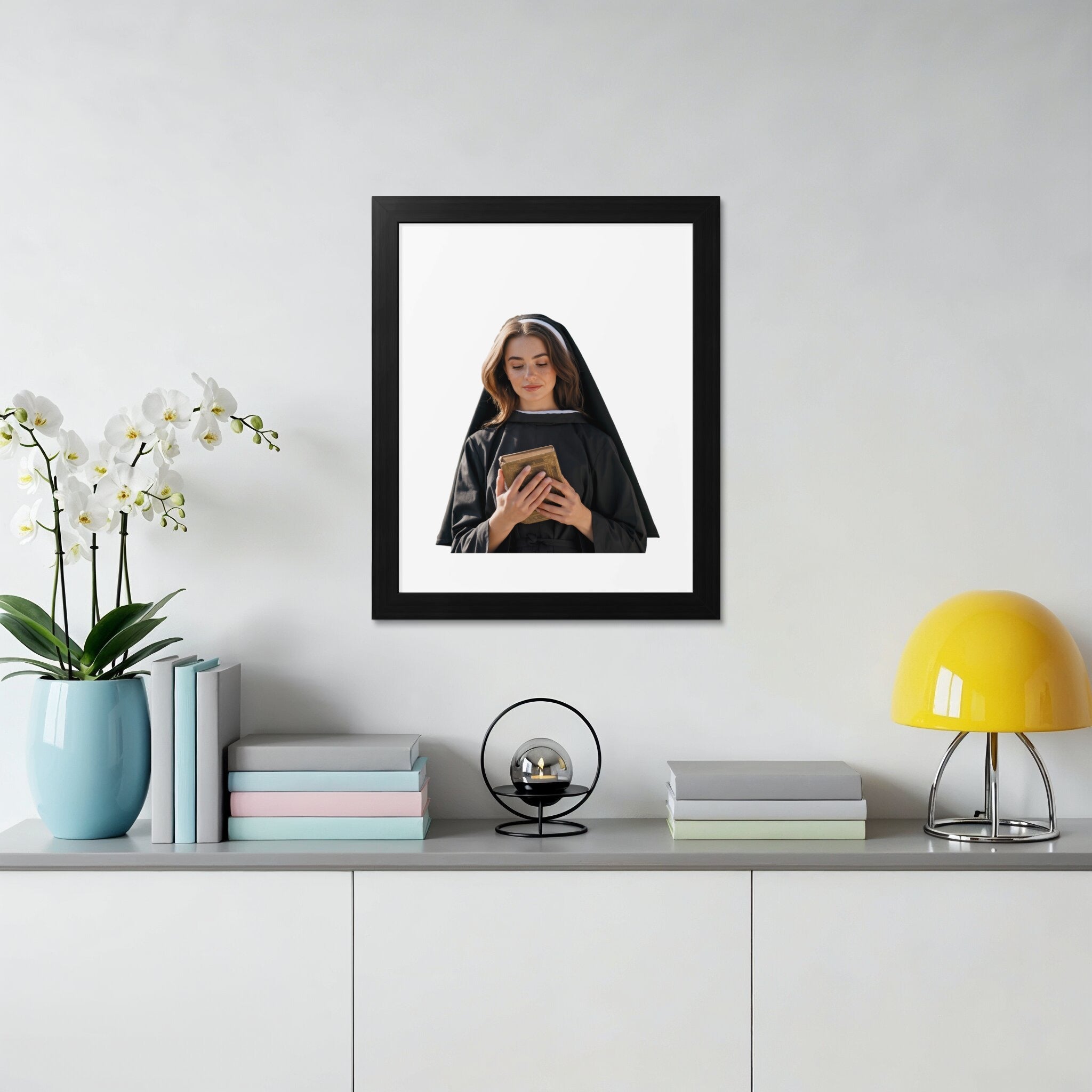 Framed portrait of a nun holding a book.