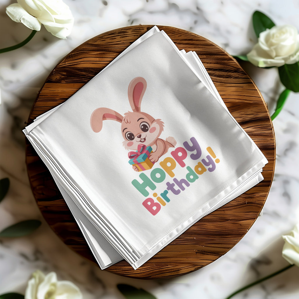 White cloth napkin with cartoon bunny and "Hoppy Birthday!" text.