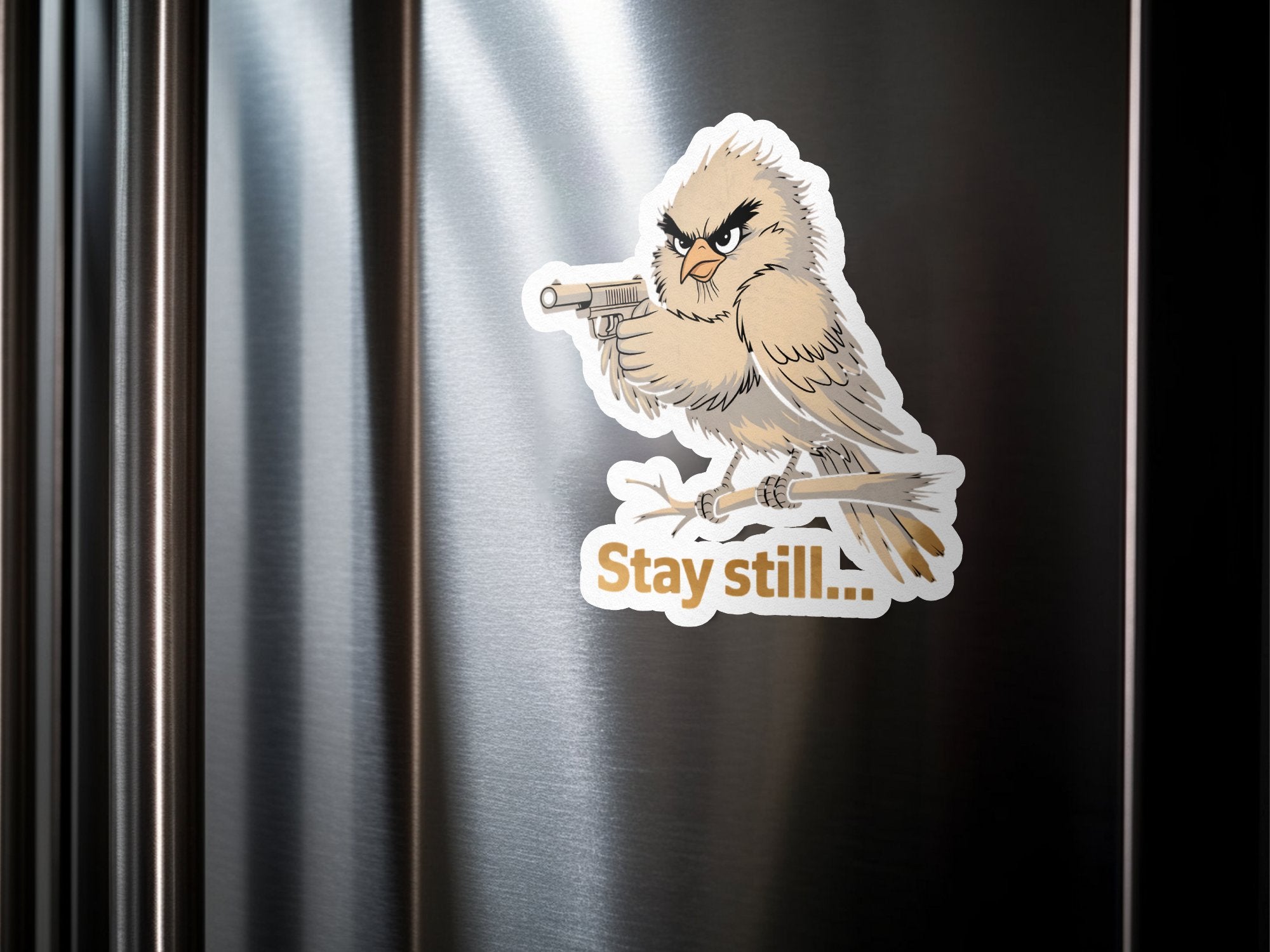 Angry bird holding a gun with text "Stay still" on a branch.