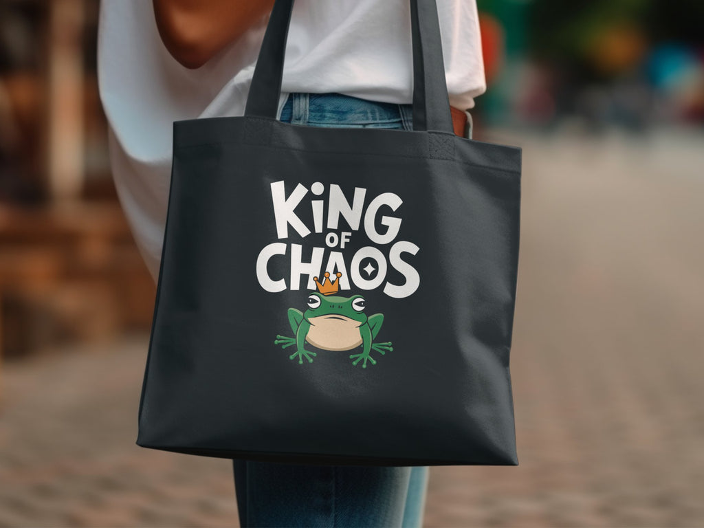 Black tote bag with "King of Chaos" text and a frog wearing a crown.