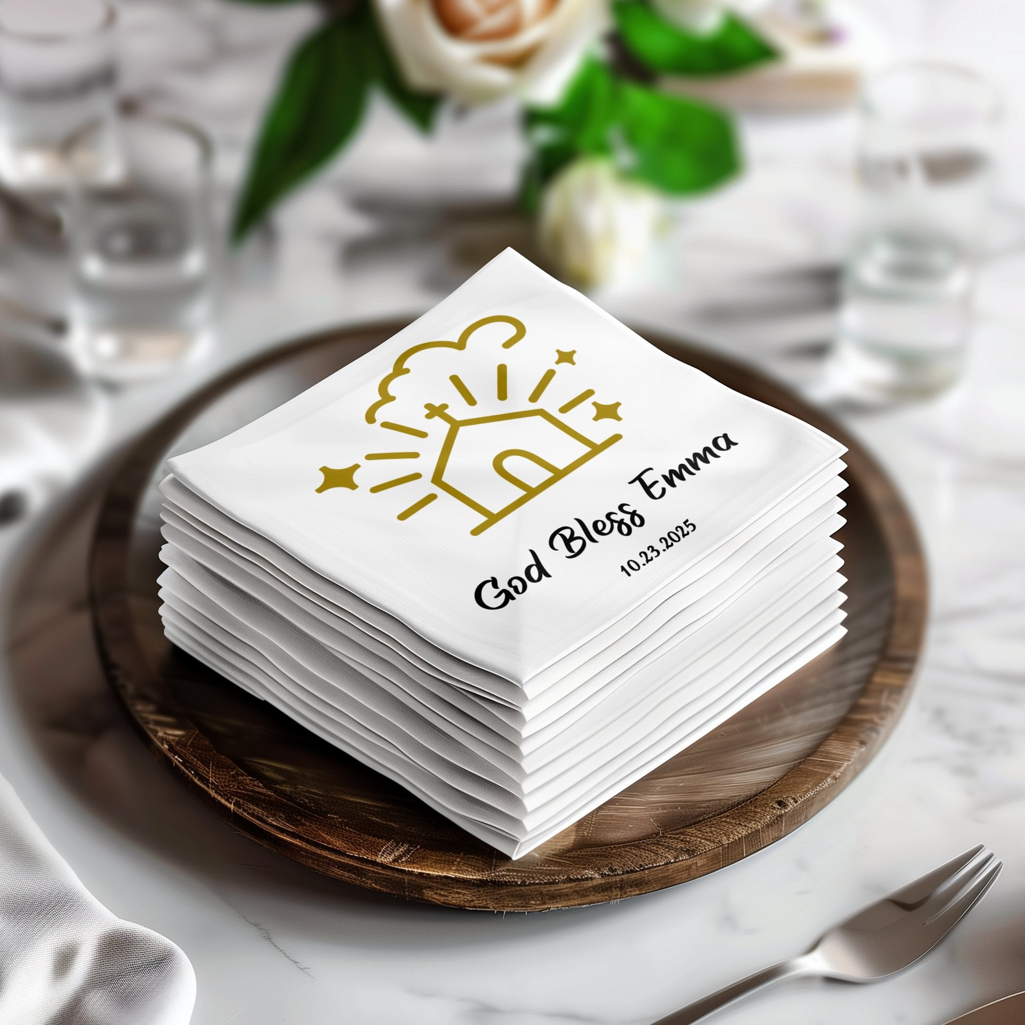 Stack of white napkins with "God Bless Emma 10.23.2025" and a house icon.