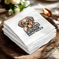 Napkin with a cartoon dog wearing glasses drinking from a mug and text "INTELLECTUALLY SUPERIOR... SLIGHTLY TIRED AT 30".