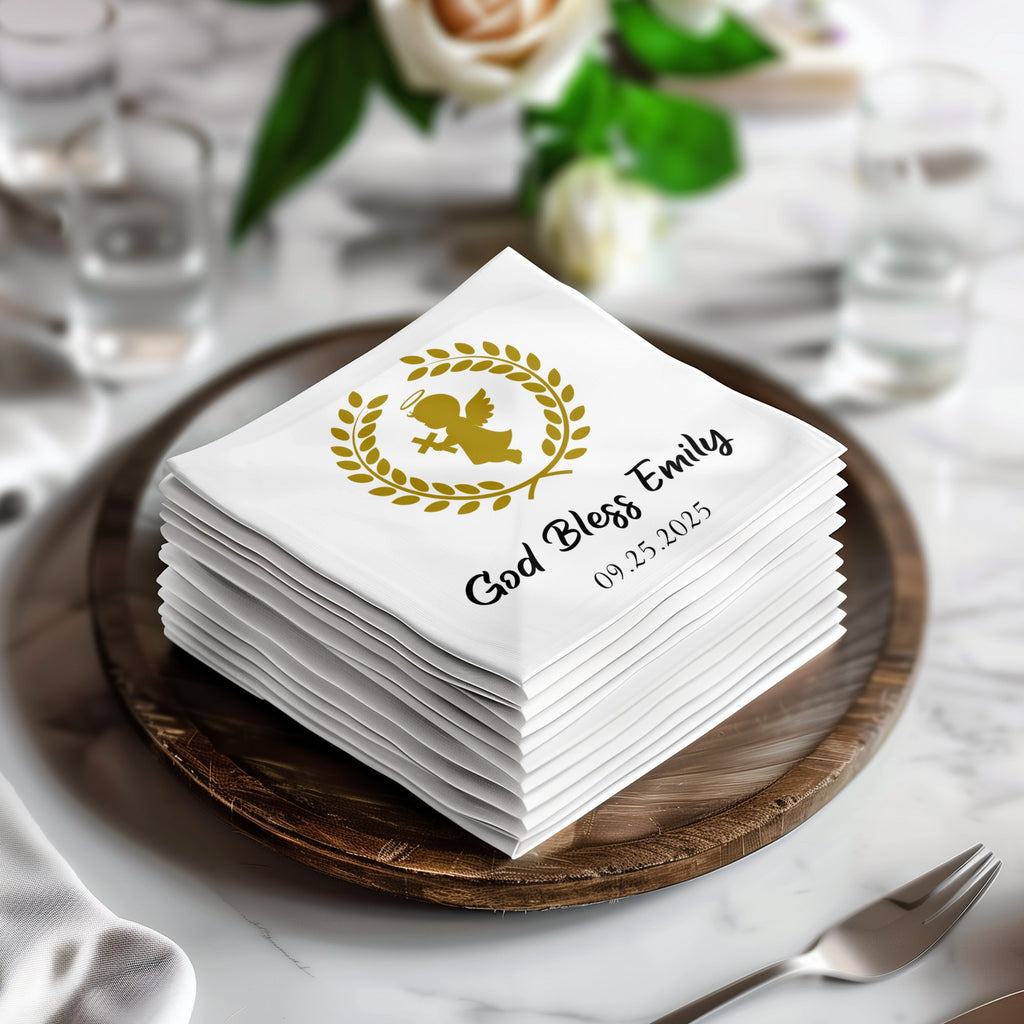 Stack of white napkins with gold angel design and "God Bless Emily 09.25.2025".