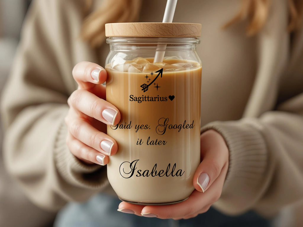 Glass jar with lid and straw, featuring "Sagittarius" horoscope symbol and personalized name "Isabella".
