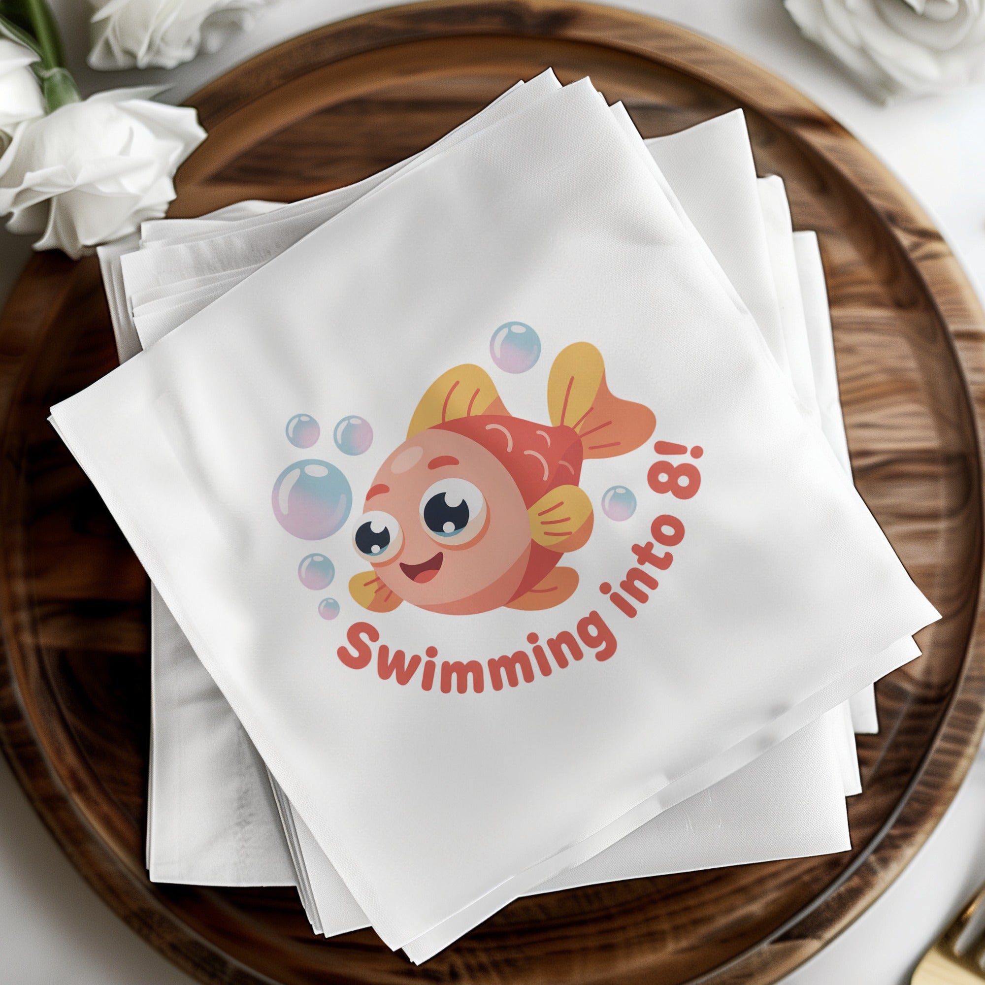 Napkin with cartoon fish and "Swimming into 8!" text.