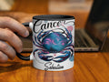 Cancer zodiac mug with crab design and "Sebastian" text.