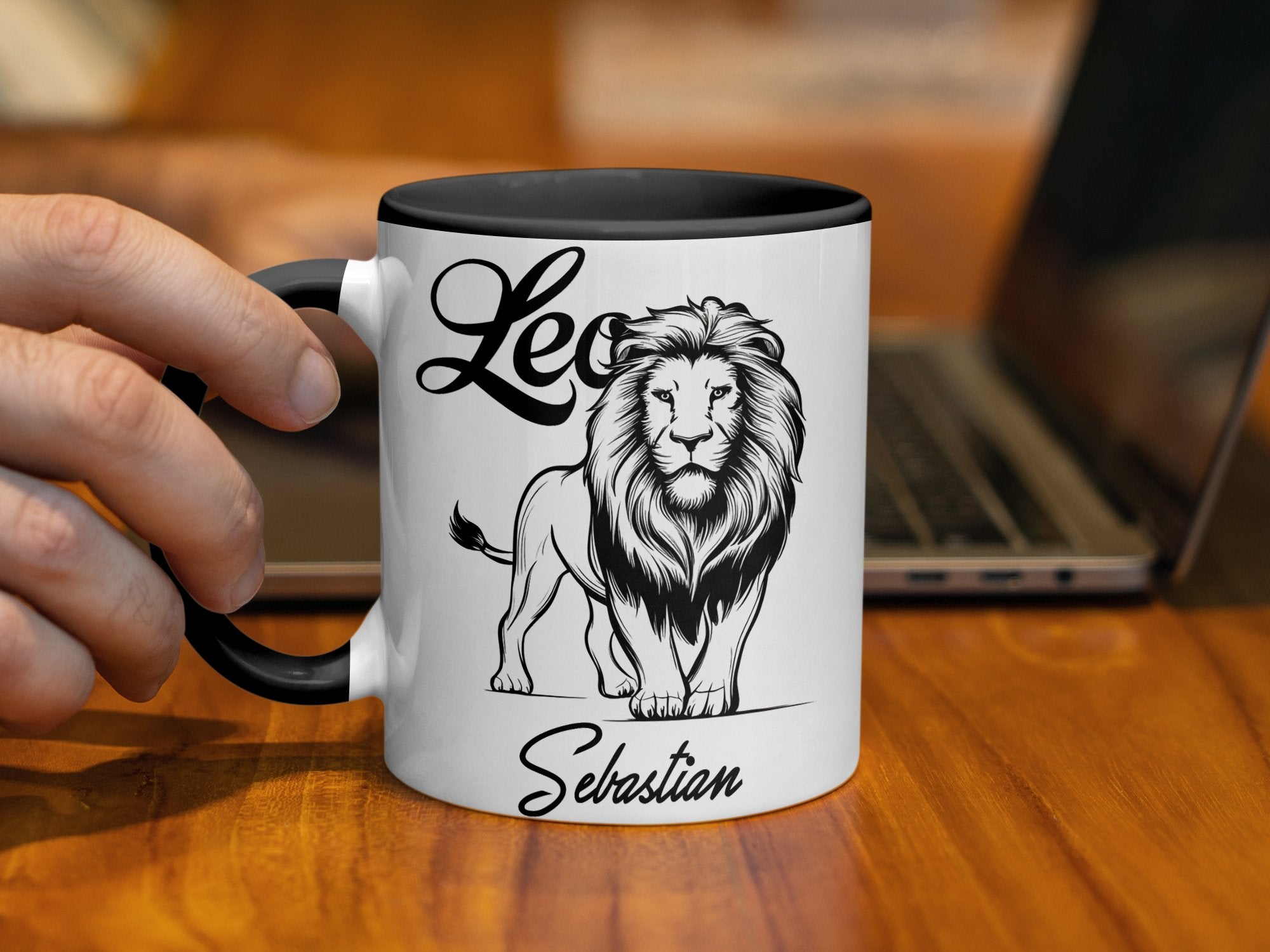 White mug with black rim featuring a lion graphic and "Leo Sebastian" text.