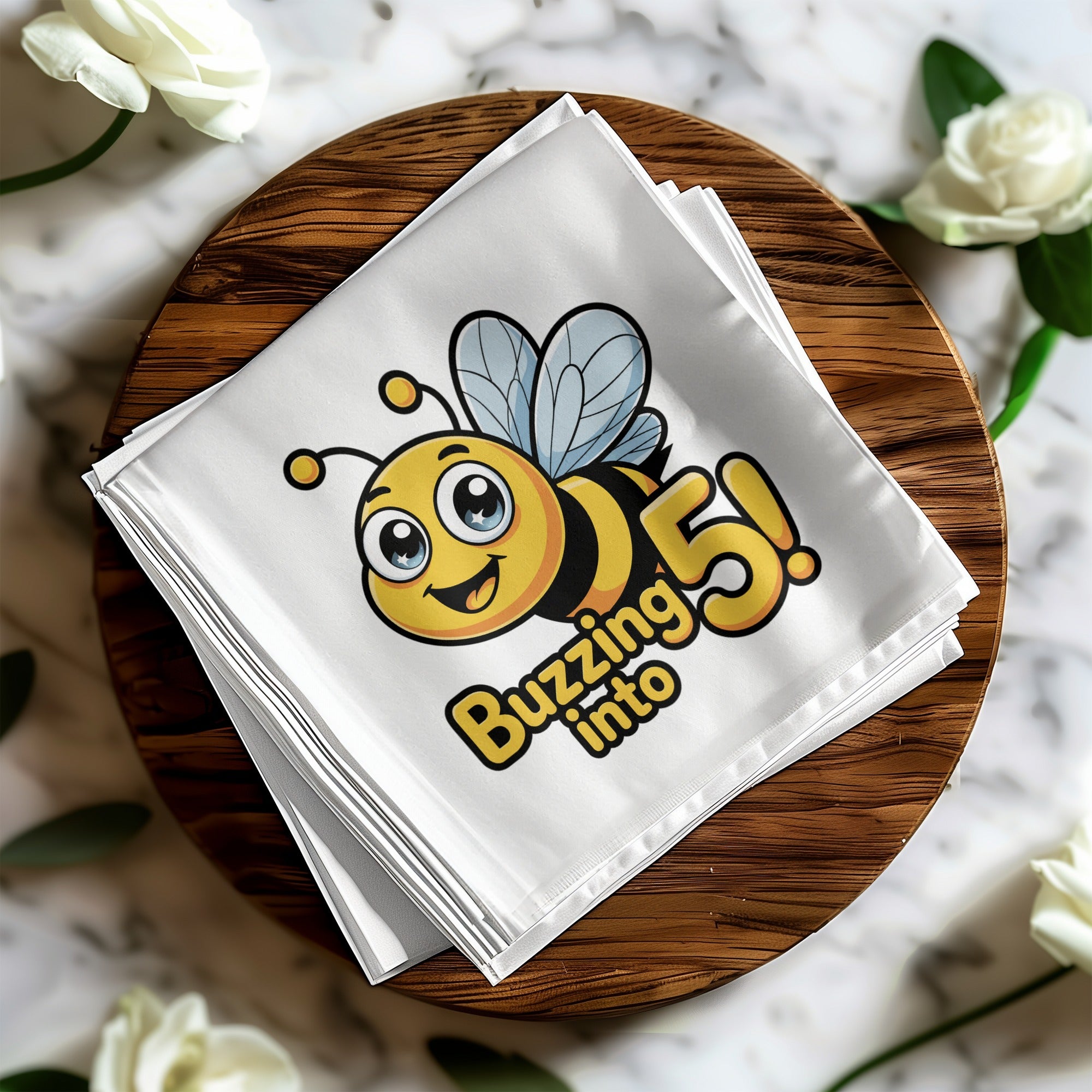 White napkin with cartoon bee and "Buzzing into 5!" text.