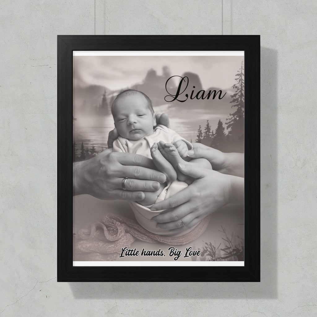 Black and white framed portrait of a newborn baby held by adult hands.