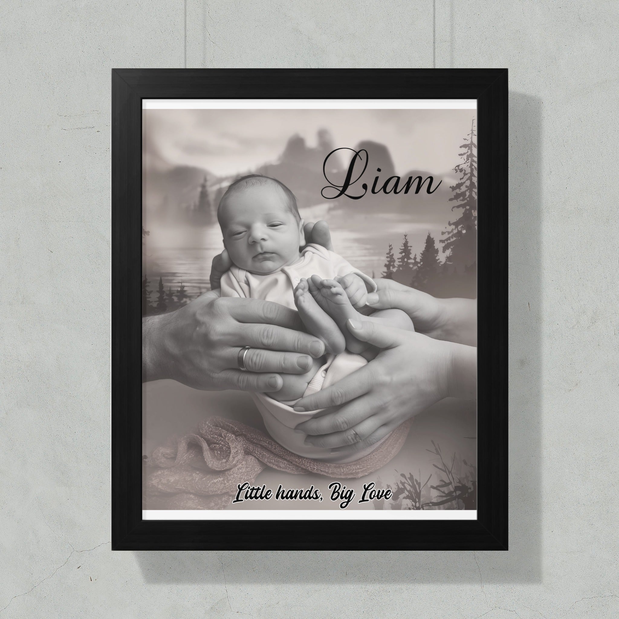 Black and white framed portrait of a newborn baby held by adult hands.