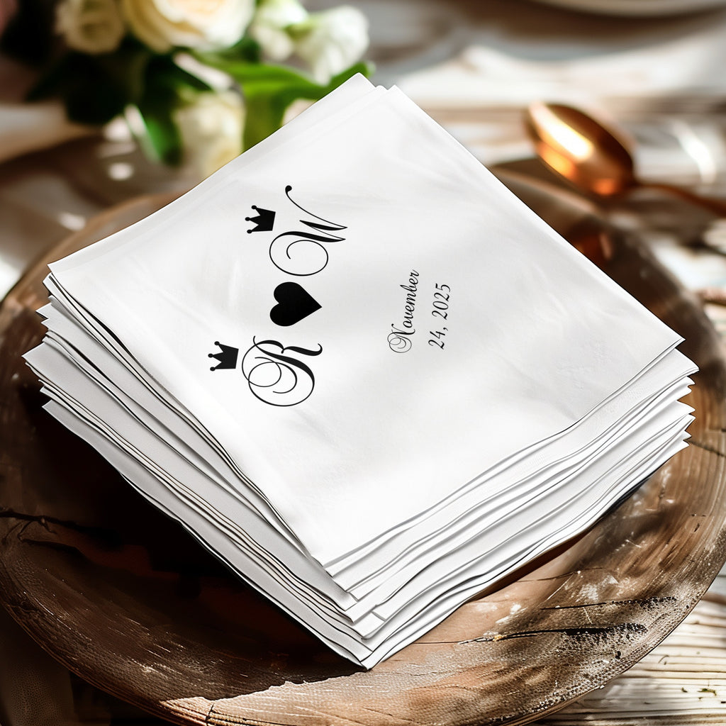 White napkins with black monogram and "November 24, 2025".