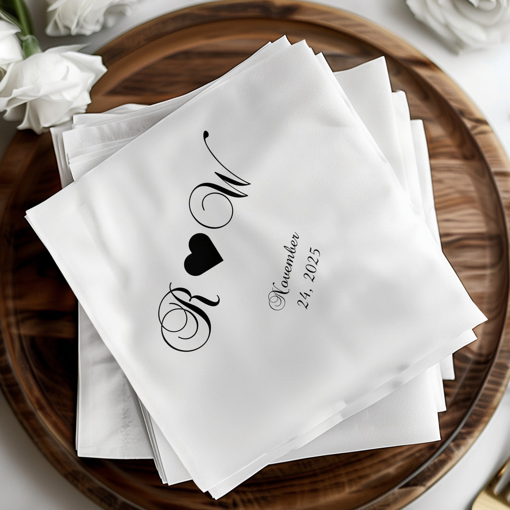White napkins with black "R W" monogram and "November 24, 2025" text.