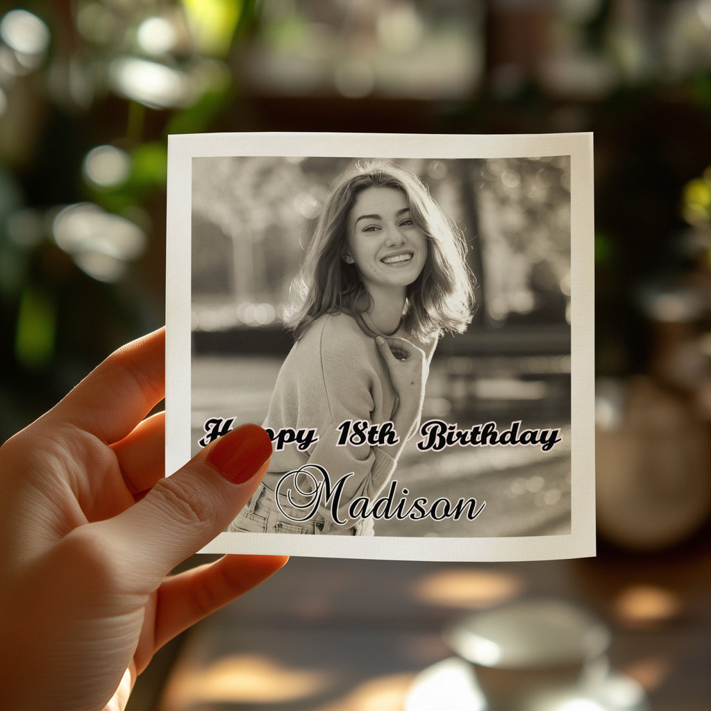 Hand holding card with "Happy 18th Birthday Madison" text and portrait.