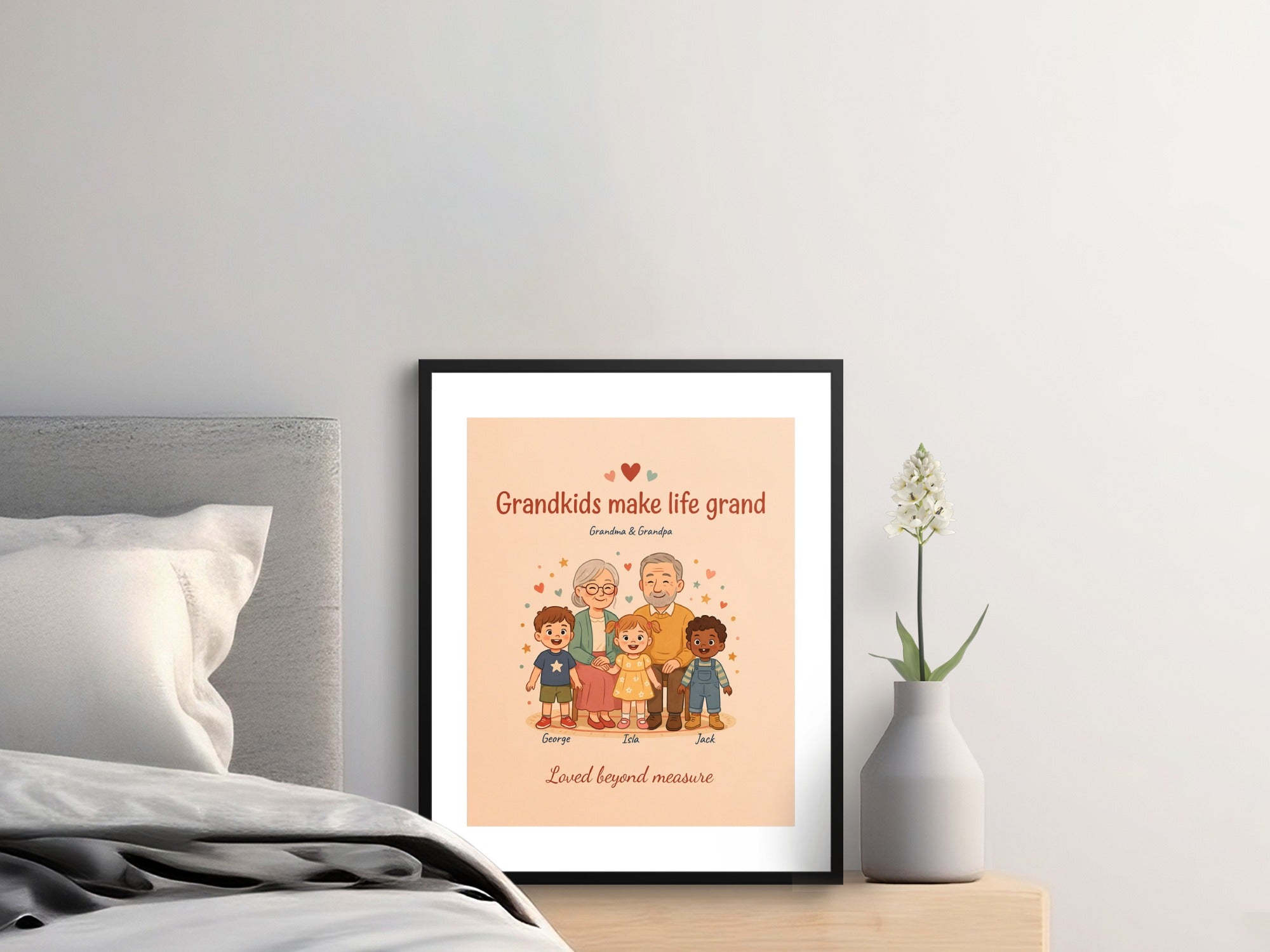 Framed artwork showing cartoon grandparents with three grandchildren and text.