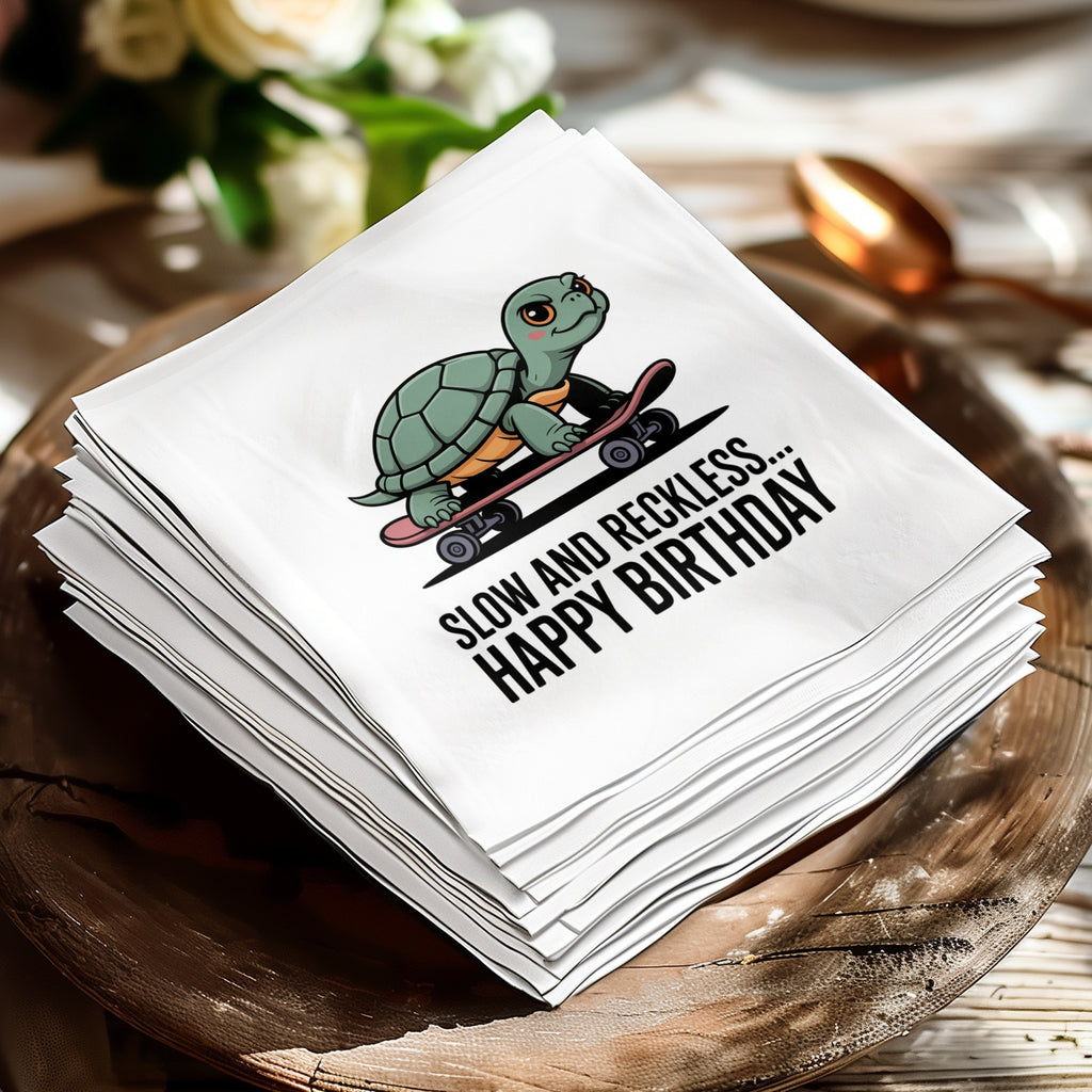 White napkin with turtle on skateboard and text "SLOW AND RECKLESS... HAPPY BIRTHDAY".