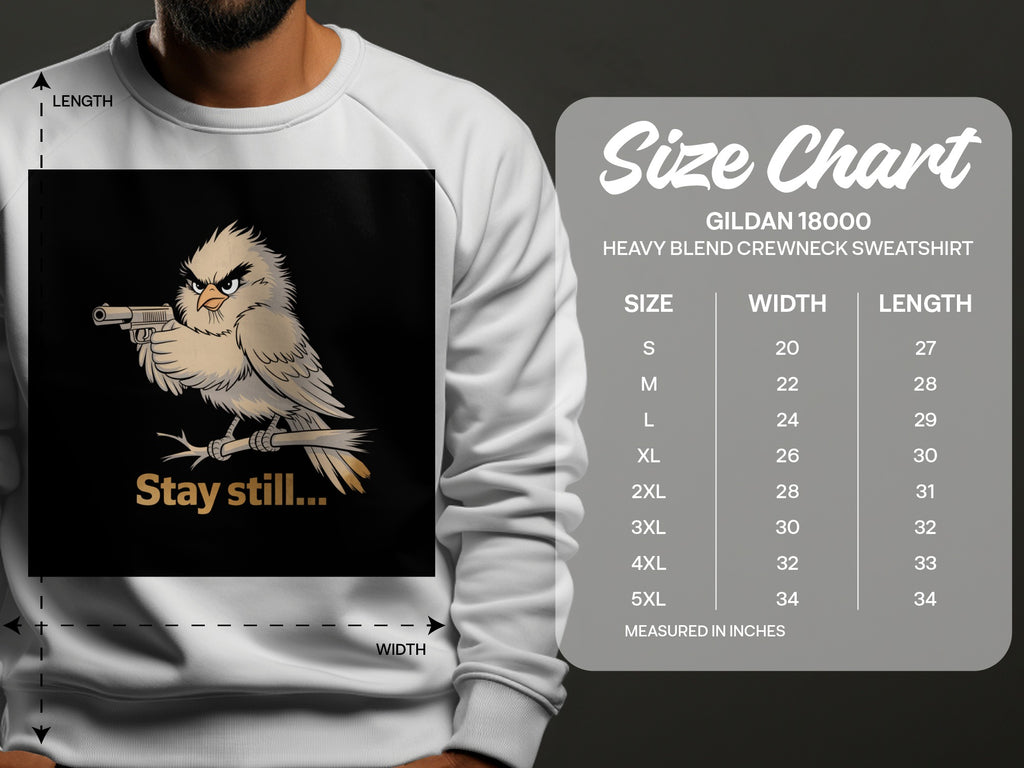 Sweatshirt graphic with a cartoon bird holding a gun and text "Stay still...".