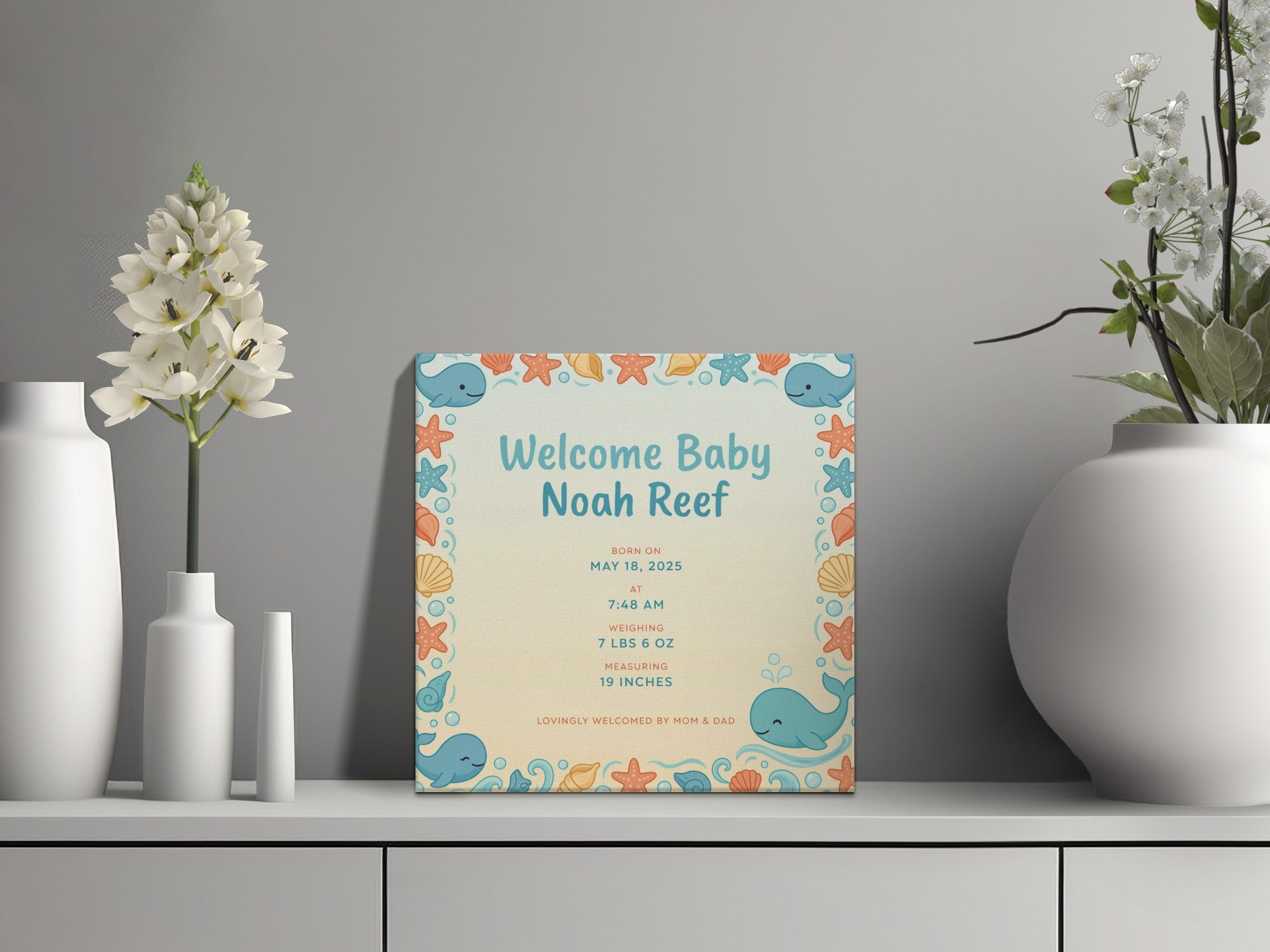 Baby Noah Reef birth announcement with whale and starfish border.
