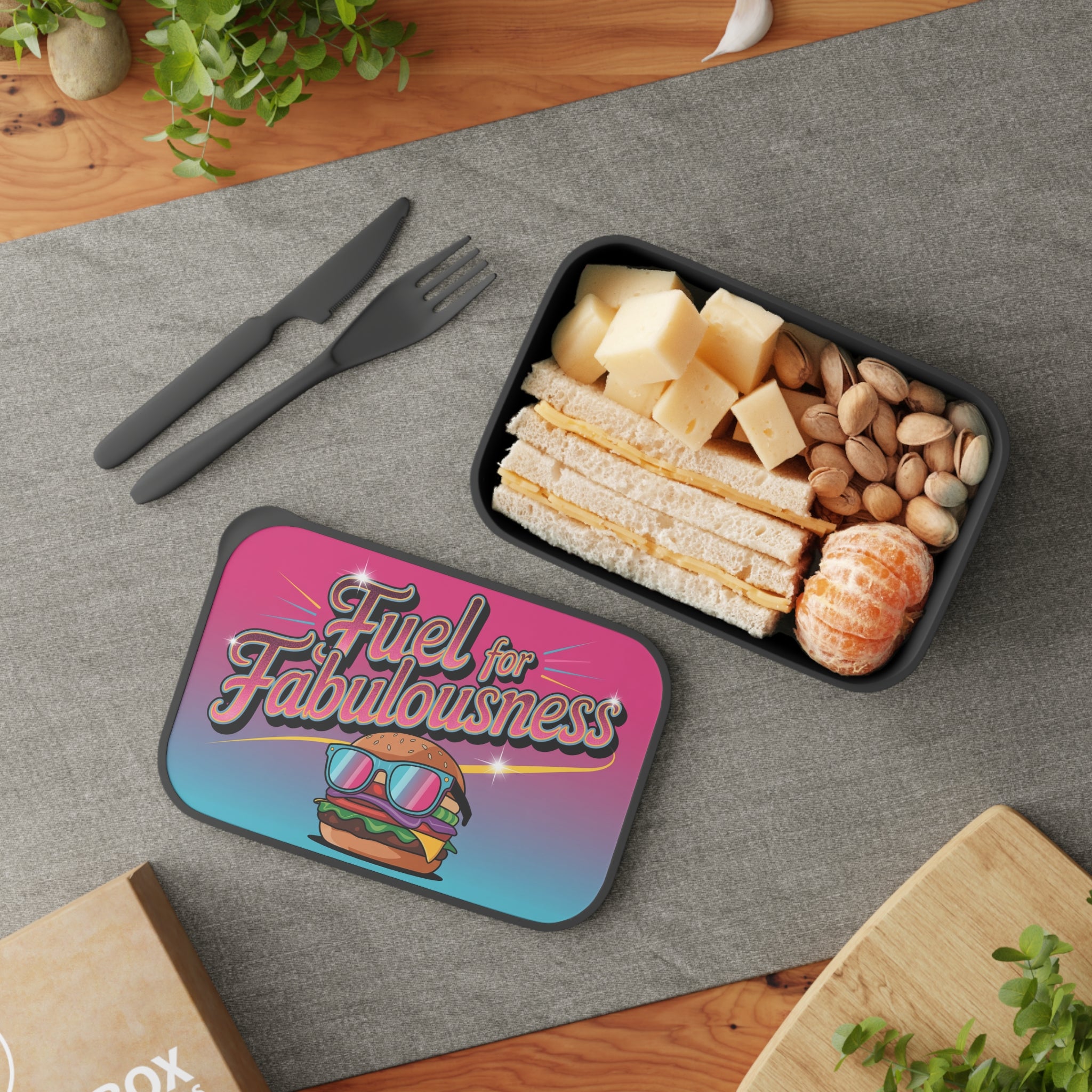 Lunchbox with sandwich, cheese, nuts, and tangerines, featuring "Fuel for Fabulousness" text.