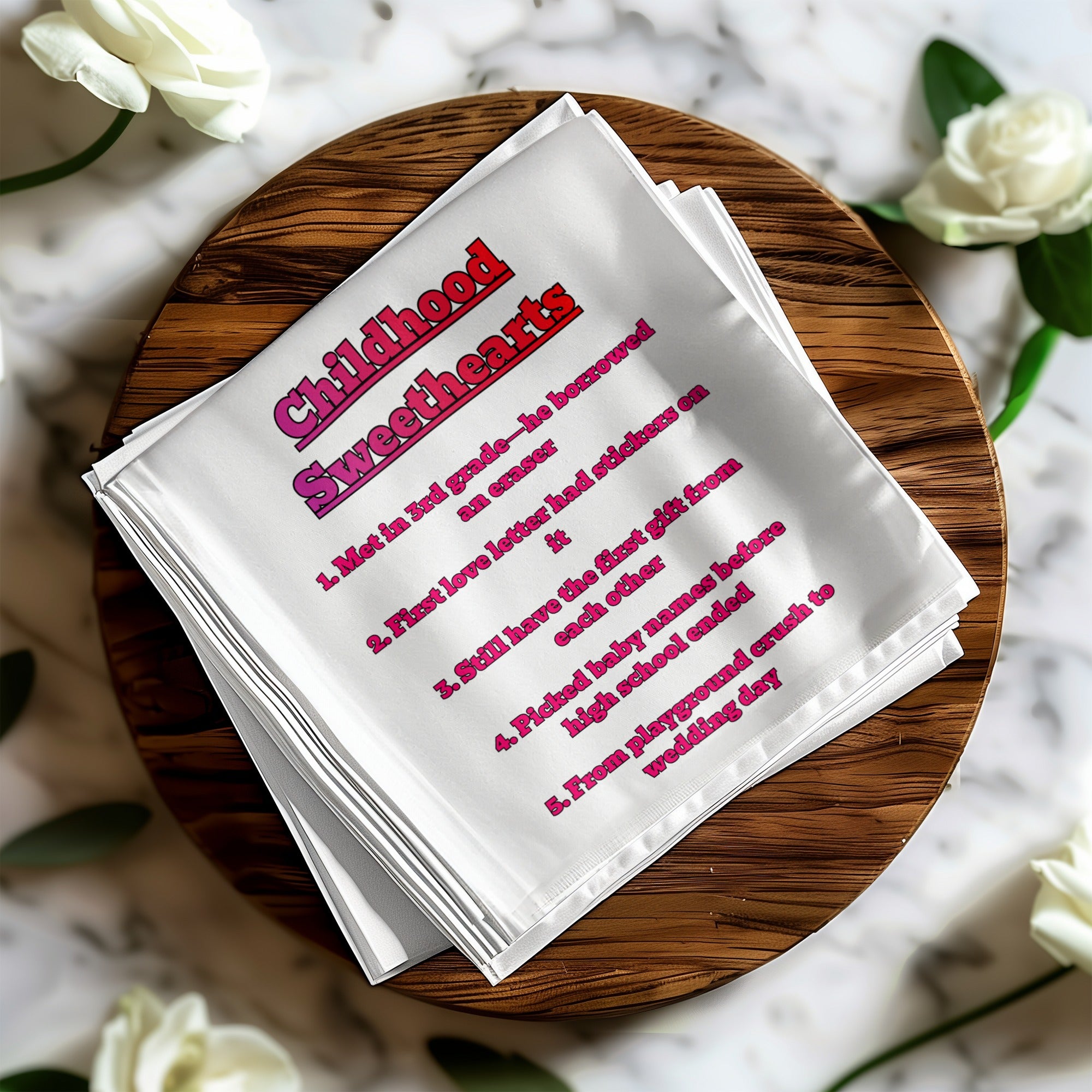White handkerchief with "Childhood Sweethearts" and list of milestones.