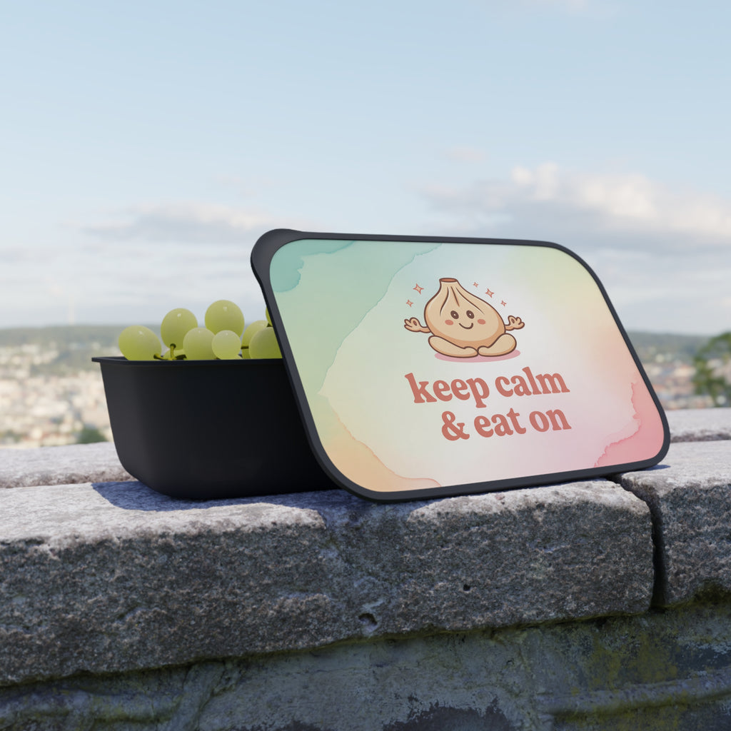 Lunchbox with cartoon dumpling and text "keep calm & eat on".