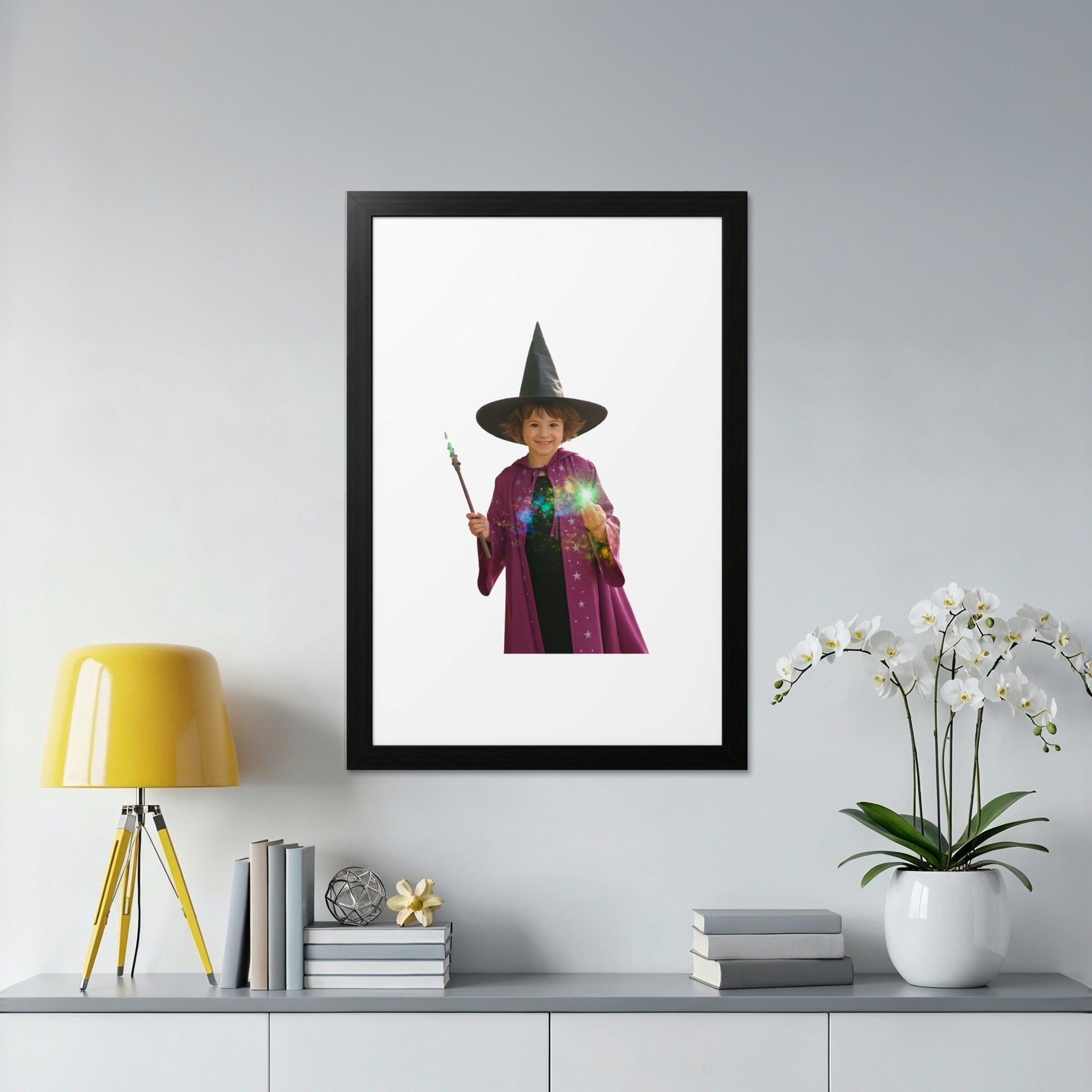 Child in wizard costume holding a glowing wand, framed in a black border.