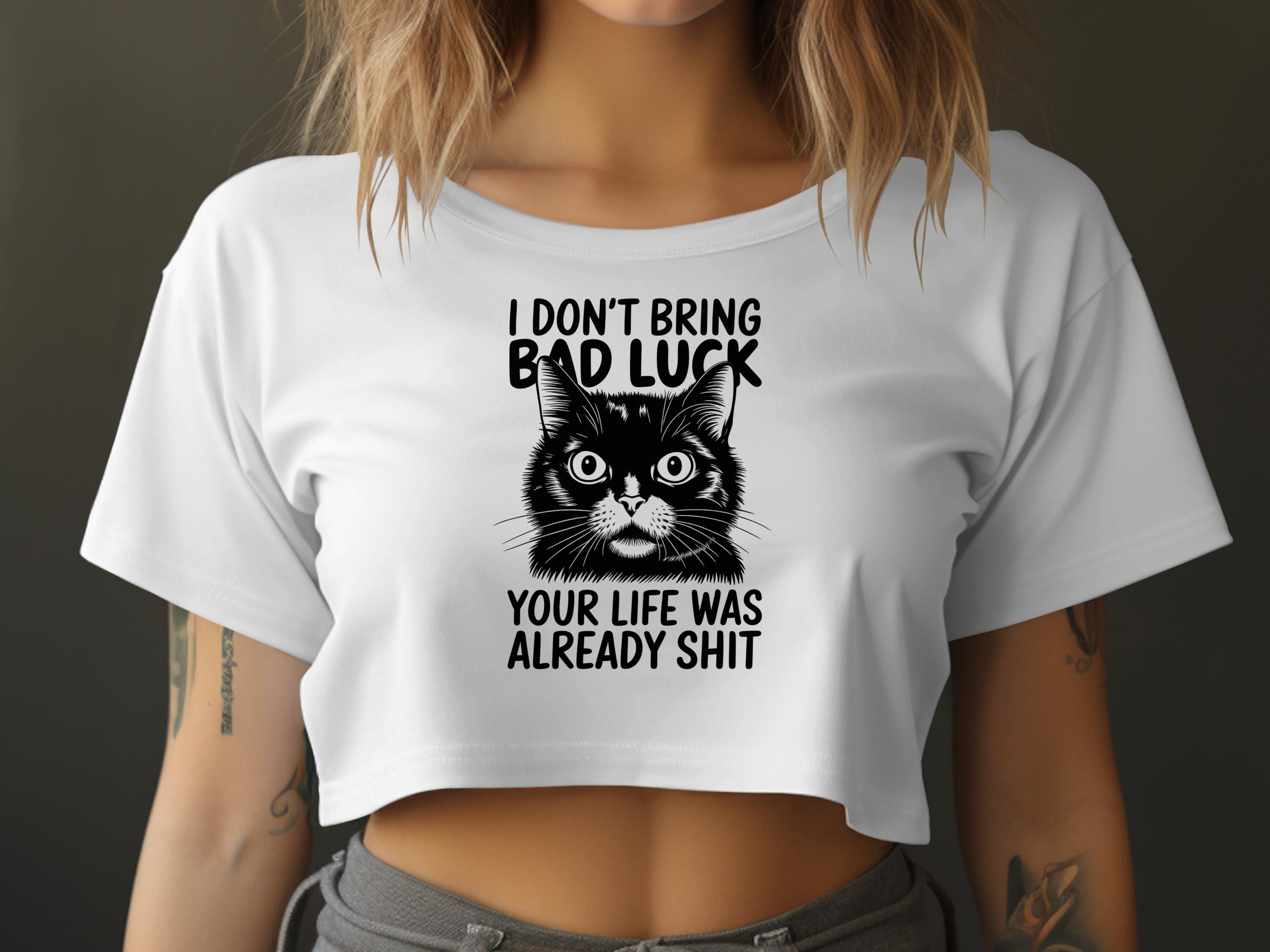 White crop top with black cat graphic and text "I DON'T BRING BAD LUCK YOUR LIFE WAS ALREADY SHIT".
