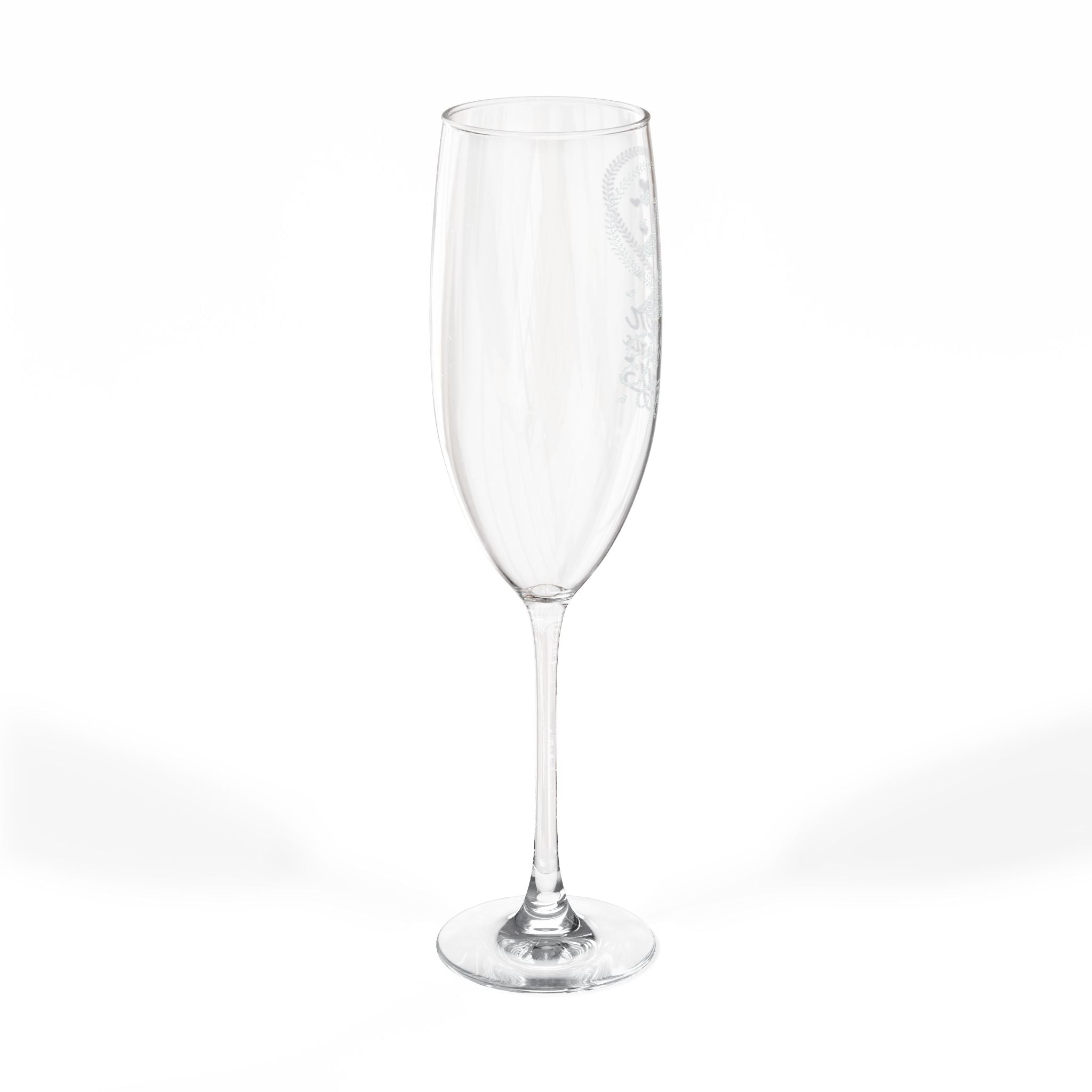 Clear champagne flute with etched floral design on the bowl.
