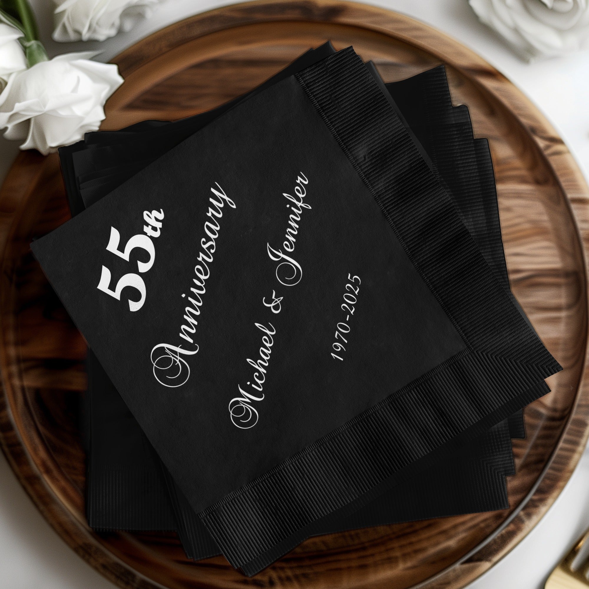Black napkins with white text for 55th Anniversary of Michael and Jennifer, 1970-2025.