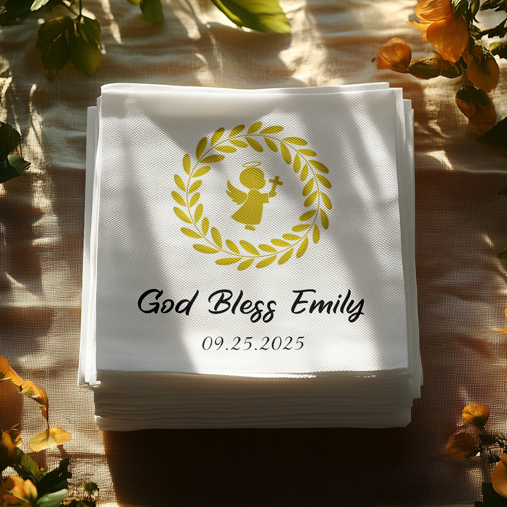 White folded napkins with "God Bless Emily" and a cross within a wreath.