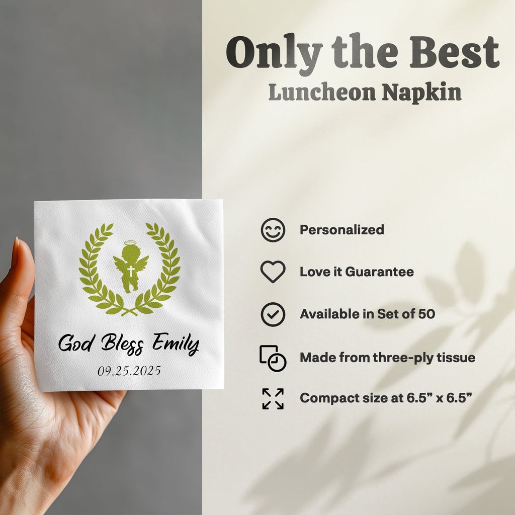 White luncheon napkin with "God Bless Emily 09.25.2025" and laurel wreath.