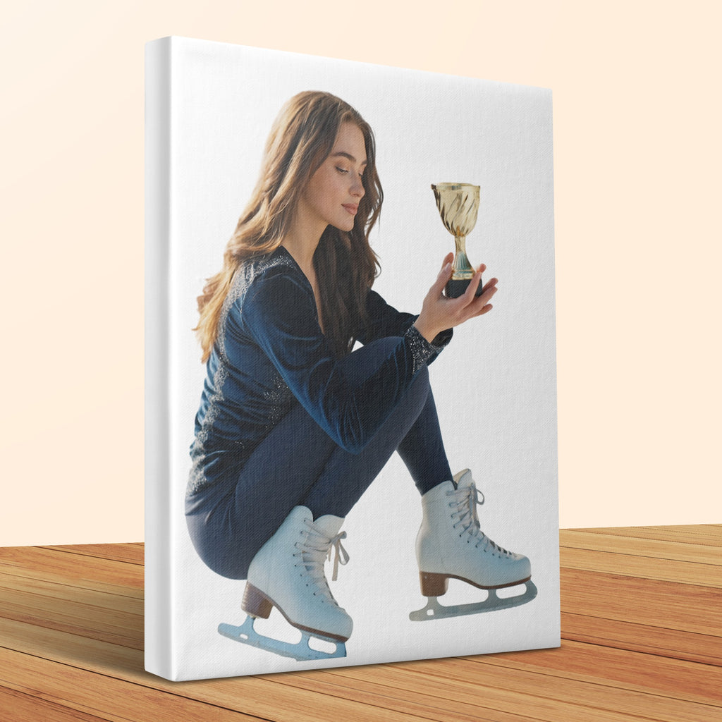 Young woman in ice skates holds a gold trophy, seated on white backdrop.