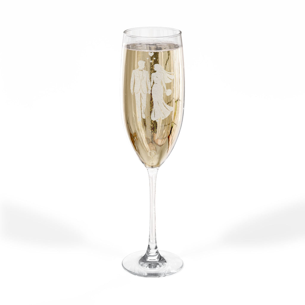 Champagne flute with etched image of a wedding couple.