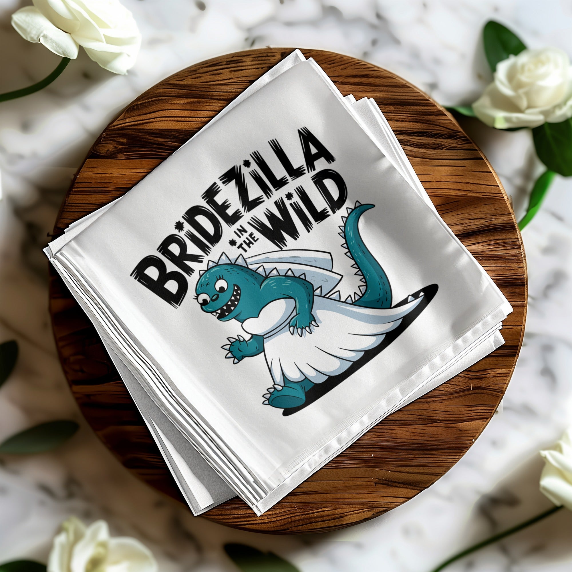 White bandana with cartoon dinosaur bride and "BRIDEZILLA IN THE WILD" text.