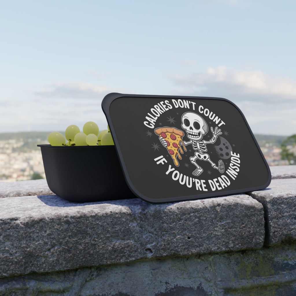 Black lunchbox with skeleton eating pizza and text "CALORIES DON'T COUNT IF YOU'RE DEAD INSIDE".
